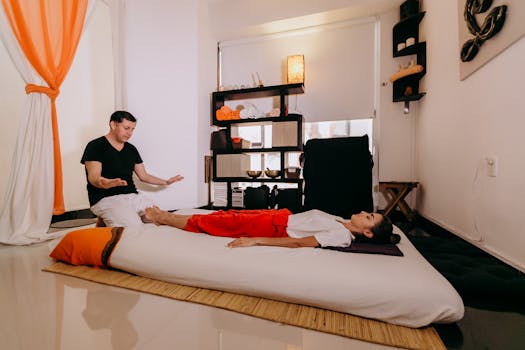 A relaxing spa session with a masseur and client in Playa del Carmen, Mexico, offering therapeutic massage services.