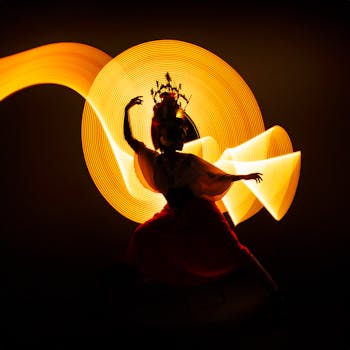 Silhouette of a Catrina dancer with vibrant light trails in a dark setting, embodying Mexican culture.
